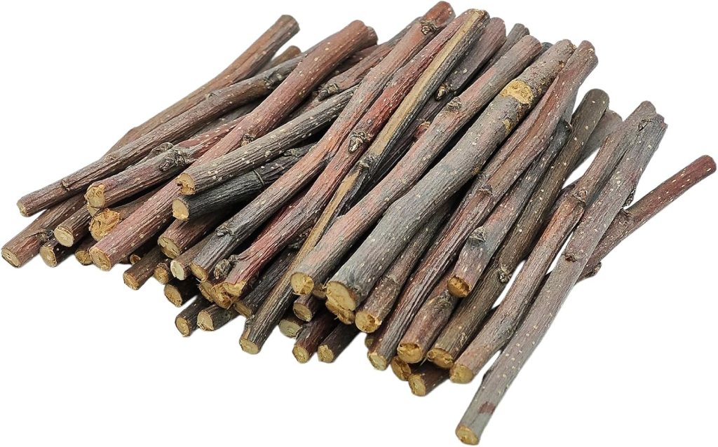 A pile of small, thin twigs with a mix of brown and gray colors, arranged haphazardly.